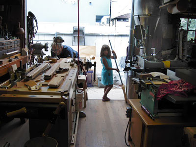 Jay G. and his family in their redesigned woodshop with new Component System