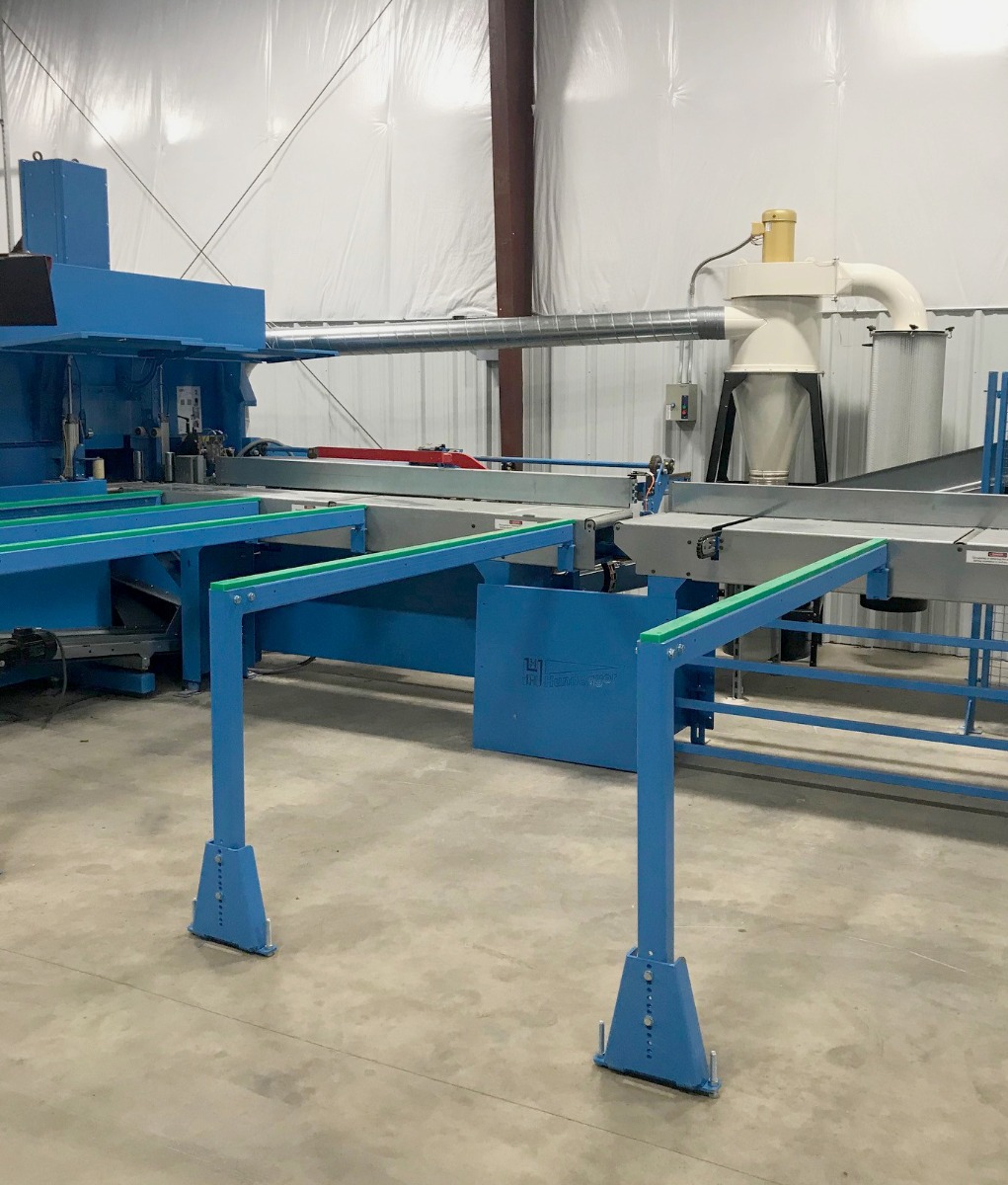 Oneida Air Systems’ High Vacuum dust collector connected to a Hundegger CNC component saw