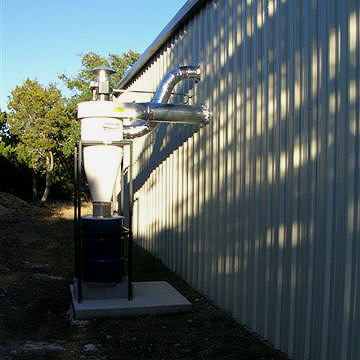 Dust Collector installed outside with exhausted extended back into the shop